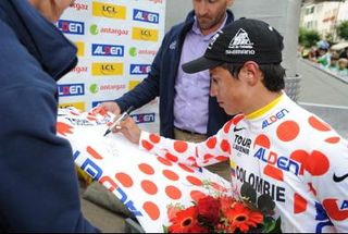 Johan Esteban Chaves signs a polka dot jersey