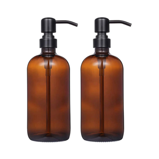 Two amber glass soap dispensers