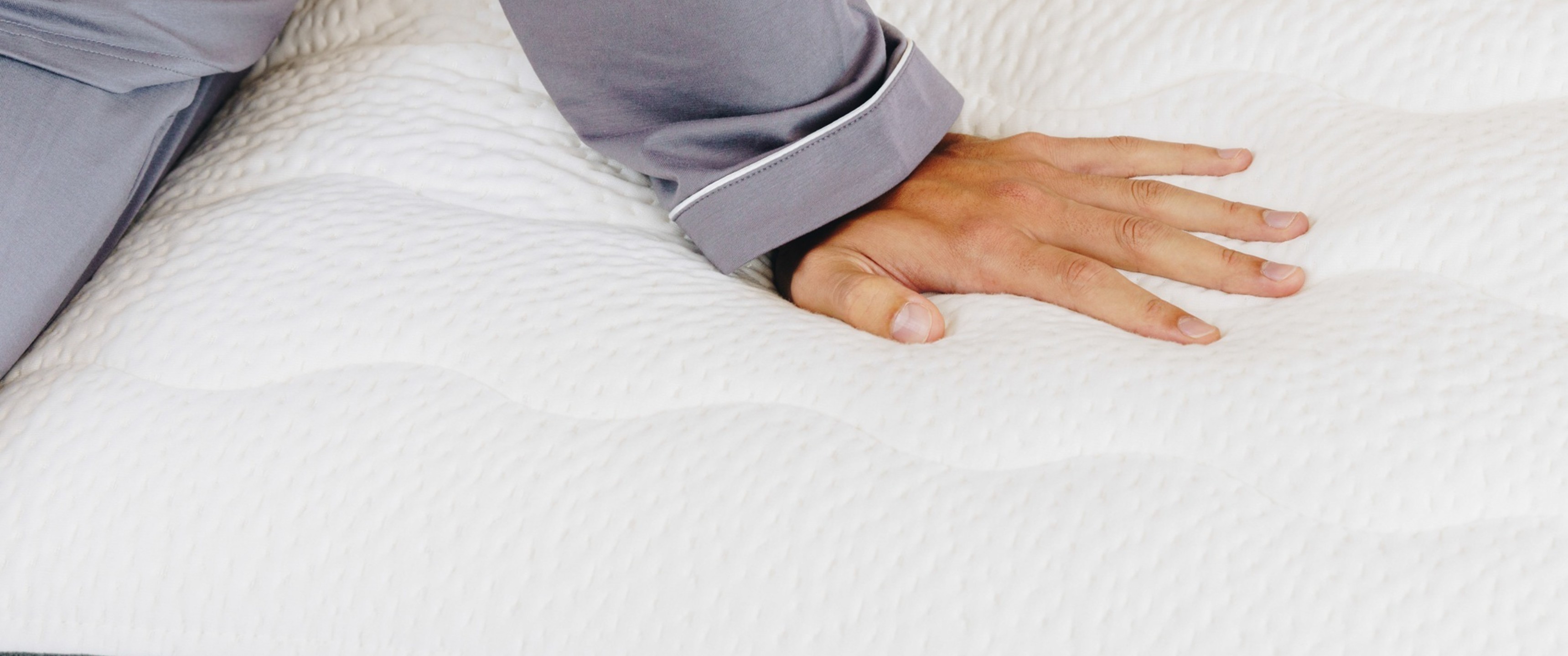 Woman sat on bed