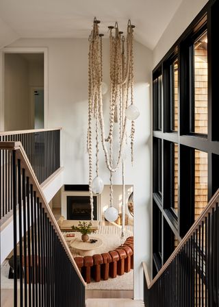 A wooden staircase leading t the lower level living room