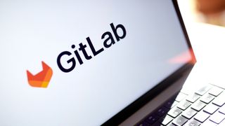GitLab logo and branding pictured on a laptop screen with white background.