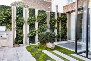 vertical garden slats on a patio in an urban courtyard