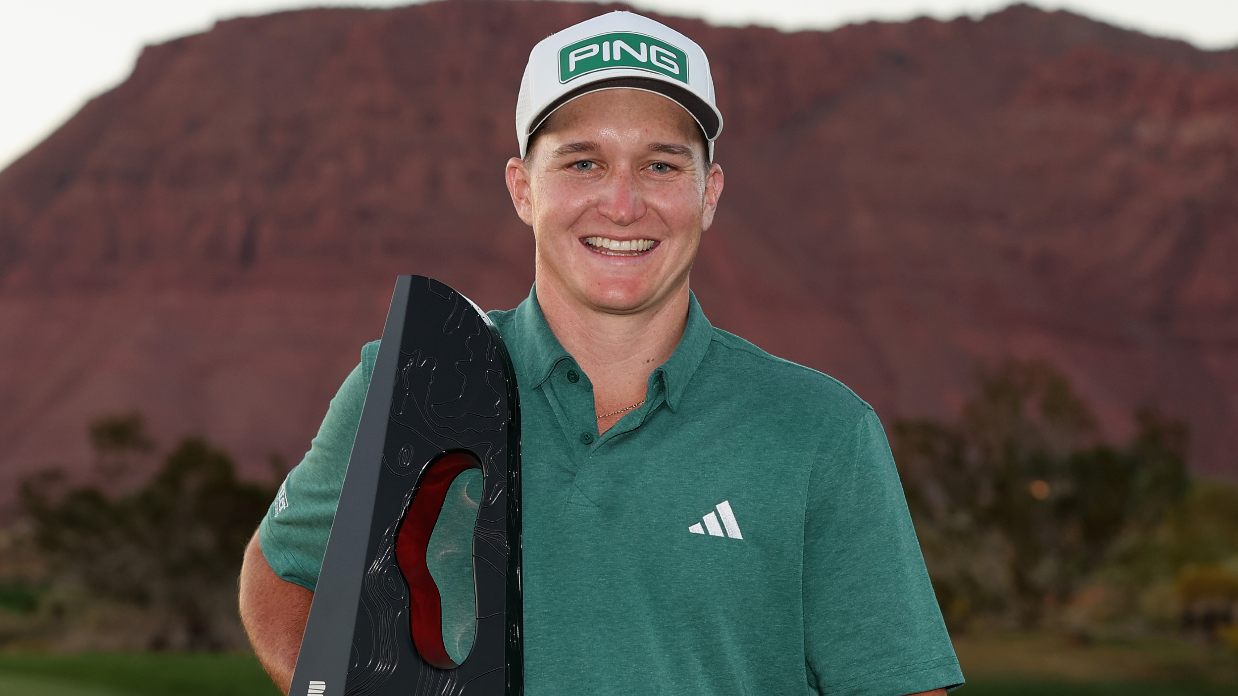Matt McCarty with the Black Desert Championship trophy