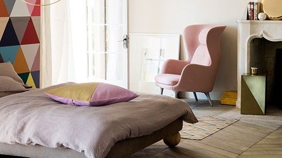 bedroom with white wall and armchair