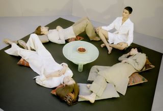 a group of men lying down in a circle