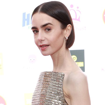 Lily Collins wore a strapless gold dress from Carolina Herrera to the King&rsquo;s Trust Celebration in London