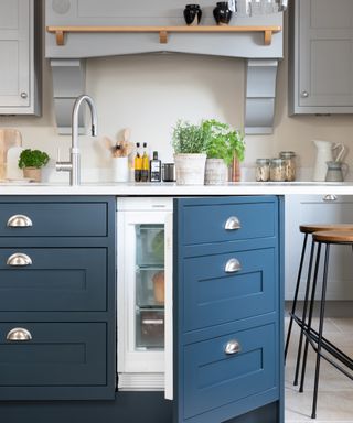Blue Shaker style kitchen with built-in fridge