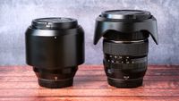 Fujifilm XF 10-24mm f/4 and 56mm f/1.2 lenses on a wooden surface
