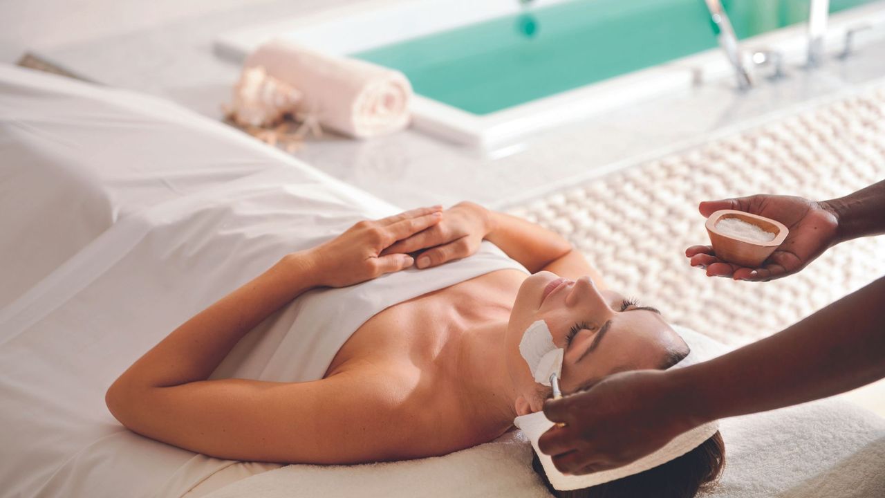Woman receiving spa treatment at Sandals
