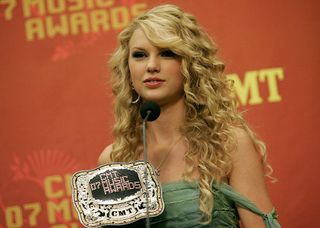 Singer Taylor Swift poses for a photo with her award for "Breakthrough Video of the Year" in the press room at the 2007 CMT Music Awards at the Curb Event Center at Belmont University April 16, 2007 in Nashville, Tennessee