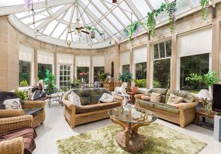 orangery with terrazzo flooring and sofa with chairs