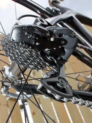 Even though there's a motor in there, there is still a return spring tucked in between the parallelogram plates.