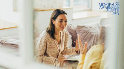 Woman having CBT for menopause in therapist&#039;s office with view looking through window