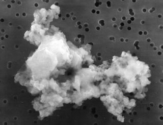 This piece of interplanetary dust is thought to be part of the early solar system and was found in Earth's atmosphere, demonstrating lightweight particles could survive atmospheric entry as they do not generate much heat from friction.