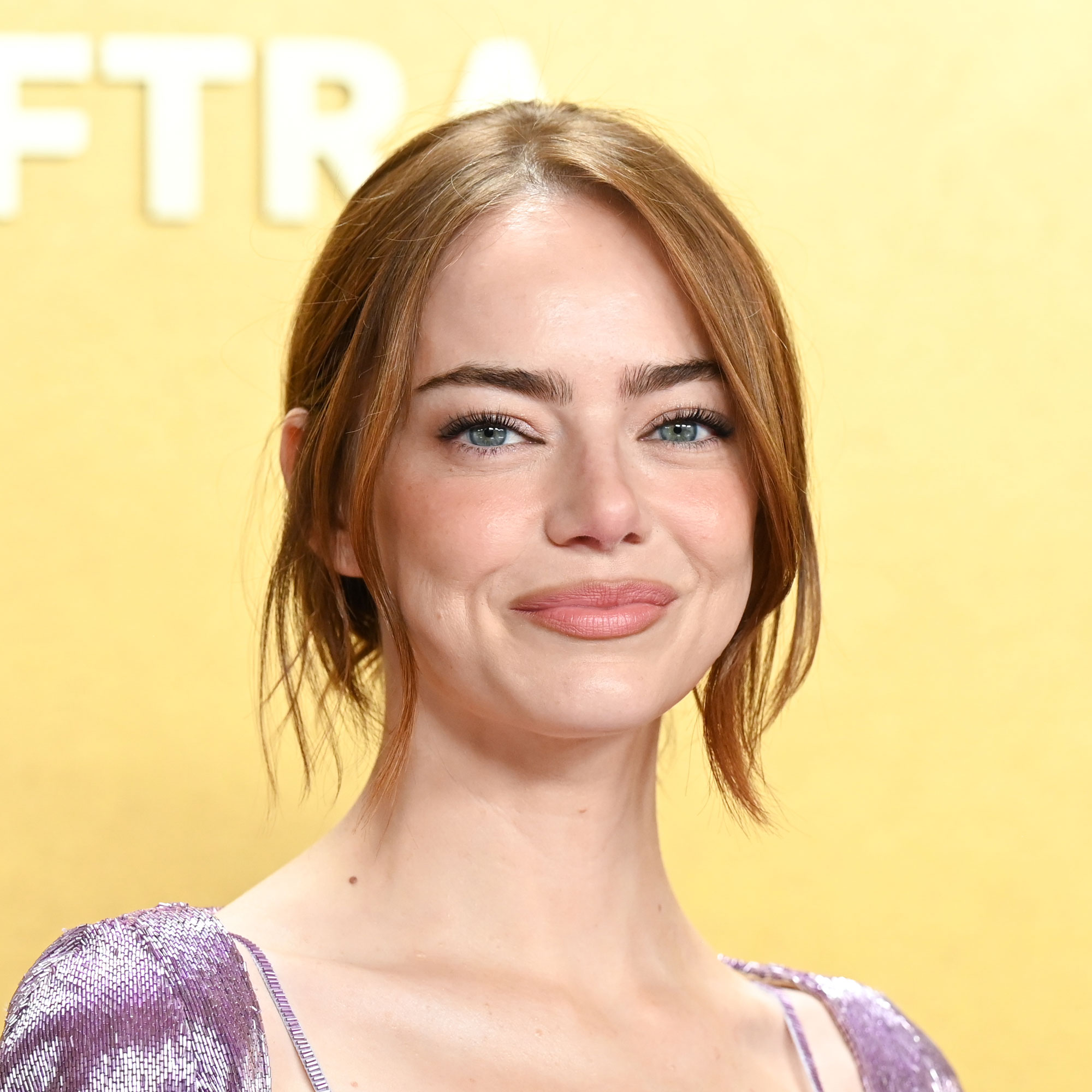 Emma Stone wears a lilac cardigan at the SAG Awards