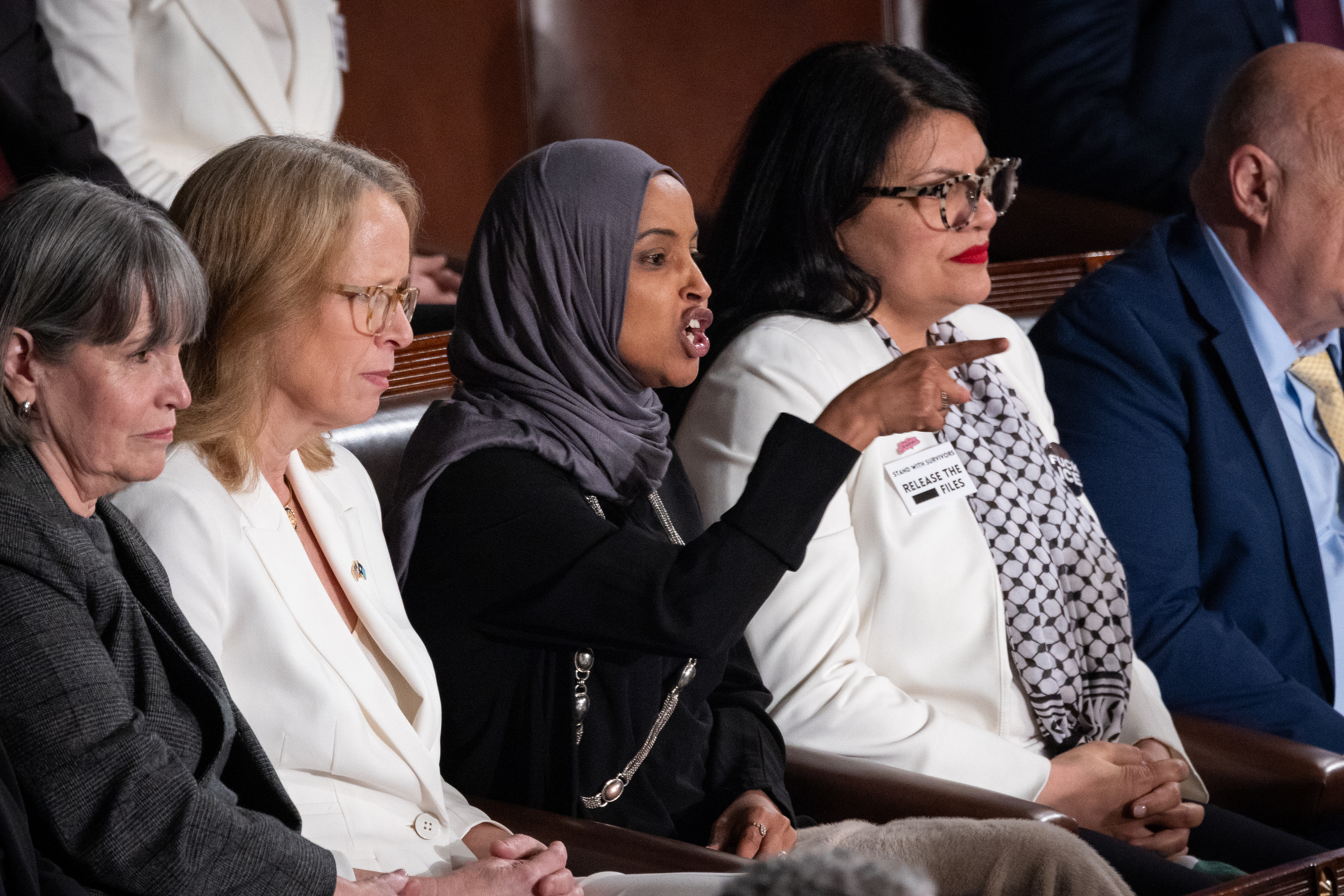 democratic congresswomen wearing white suits at the 2026 state of the union address
