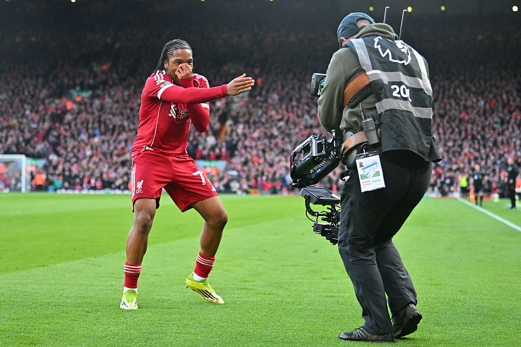 Liverpool's Rio Ngumoha celebrates for the TV camera after scoring against Fulham at Anfield in Liverpool, north west England on April 11, 2026