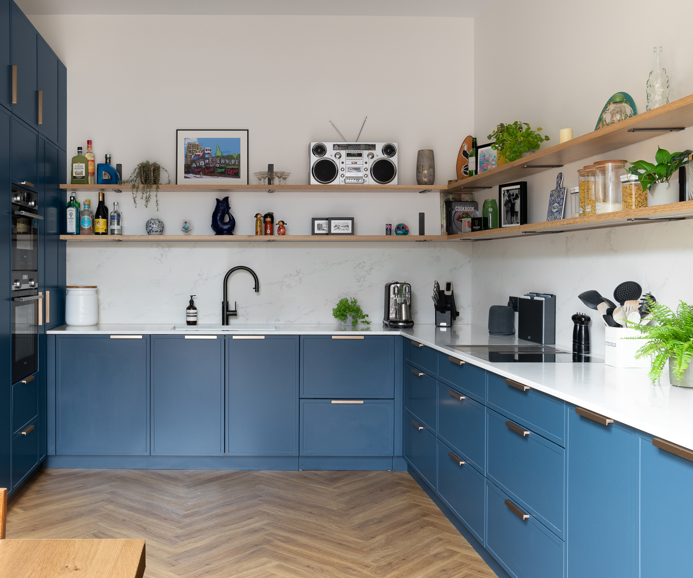 kitchen with open shelving and blue cabinets