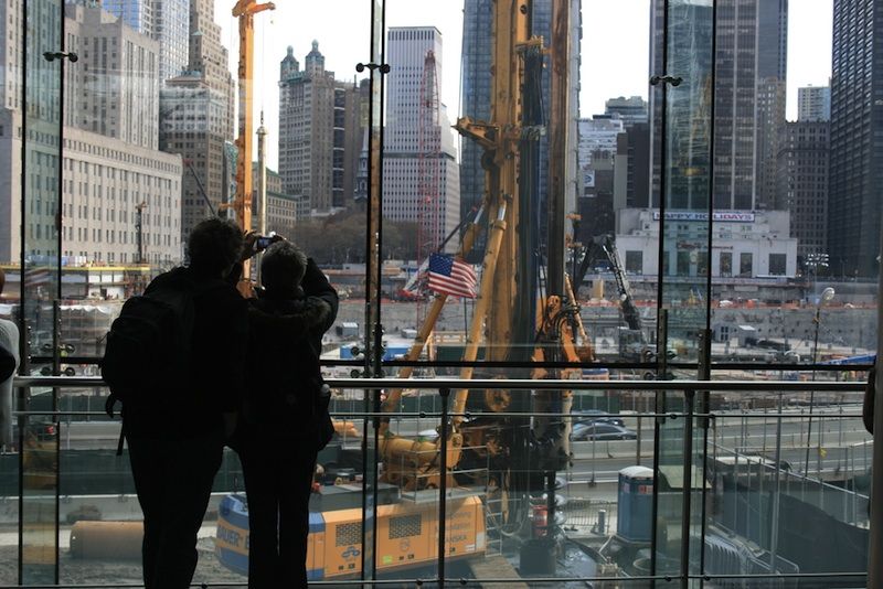 People watch construction at the World Trade Center site.