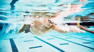 A man pictured swimming, a great low-impact way of exercising over 50