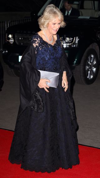Queen Camilla in a black lace gown