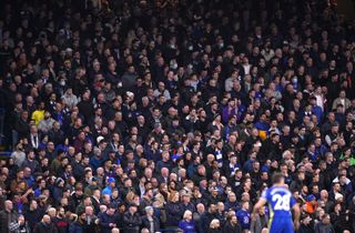 Fans in the safe-standing area watching the action at Stamford Bridge