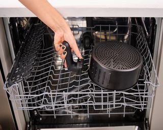 Christna Chrysostomou putting Lakeland Digital Crisp Air Fryer inside dishwasher