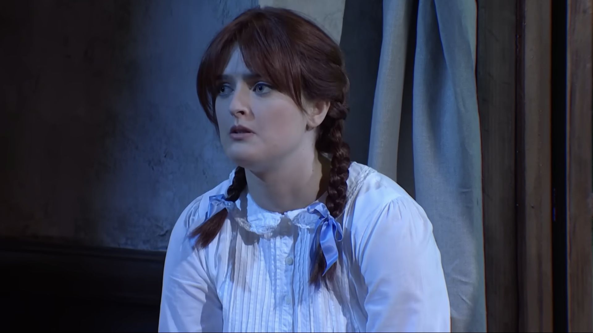 An orphan (Chloe Troast) sings about wanting to get adopted during a sketch on Saturday Night Live.