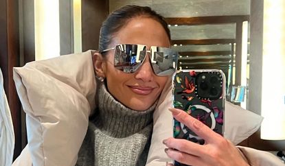 Jennifer Lopez wears a gray puffer coat while in Japan 2024