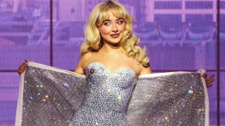 Sabrina Carpenter performing in silver corset during her Short N&#039; Sweet tour.