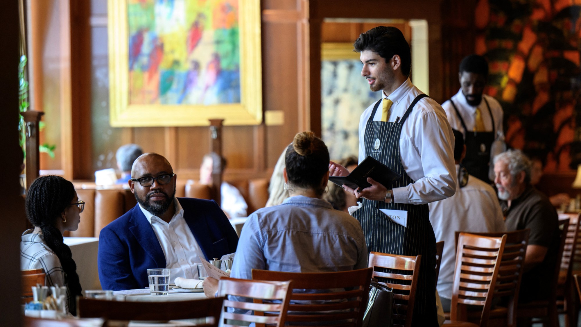 A waiter takes orders at The Hamilton restaurant in Washington, D.C. 