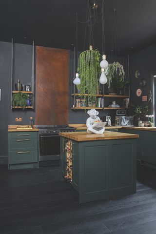 black kitchen with island and pendant lighting
