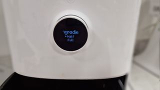Xiaomi Mi Smart Air Fryer with controls showing the option to choose half or full basket