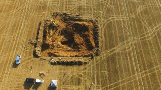 An aerial view of the crater from the explosion of the V2 rocket in 1944 being excavated last month. The site was an orchard when the rocket hit it 77 years ago.