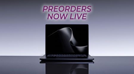 A sleek Surface Laptop Ultra sits open on a reflective surface against a gray studio backdrop, its screen displaying an abstract dark wave for a modern, minimalist feel.