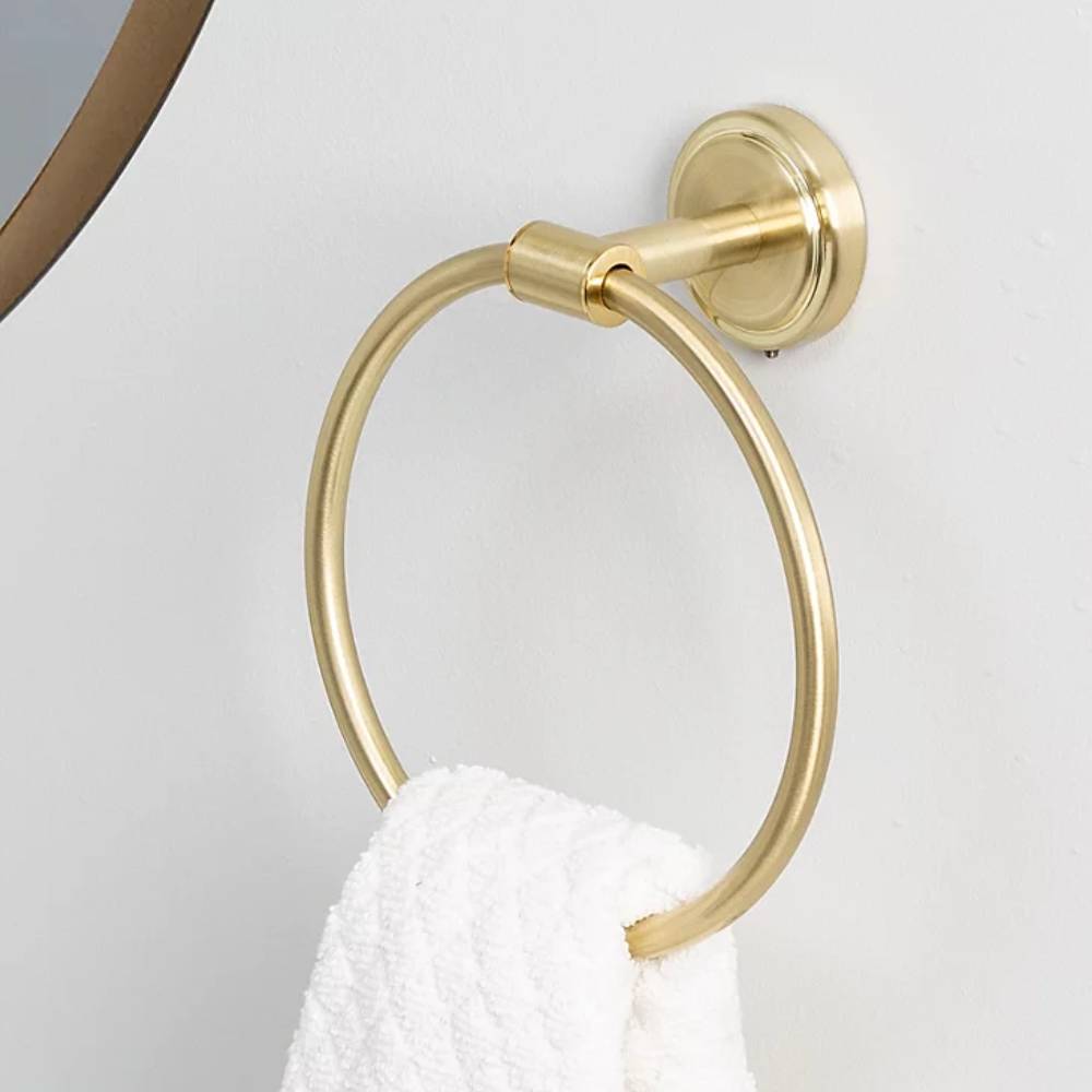 gold effect round towel holder with white towel