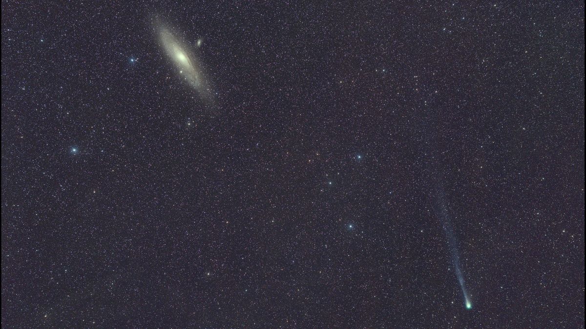 Watch the exploding green 'devil comet' zoom past the Andromeda Galaxy ...