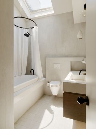 Small stone bathroom designed by General Assembly