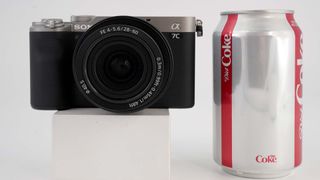 Sony A7C review — Sony A7C camera next to a Coke can
