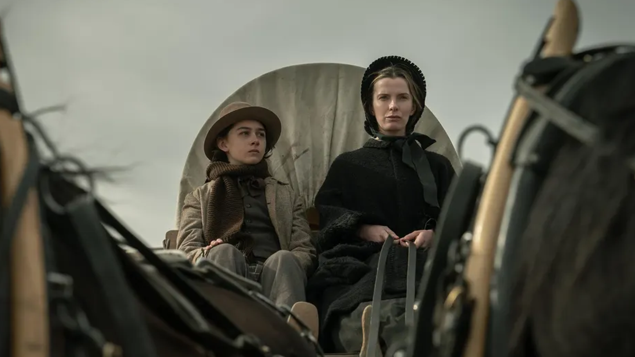 preston mota and betty gilipin as a mother and son riding on a wagon in the tv show american primeval