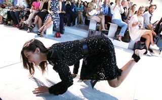 Bella Hadid takes a stylish tumble on the Michael Kors show at NYFW