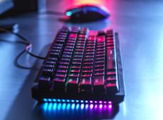 A computer keyboard and mouse lit up