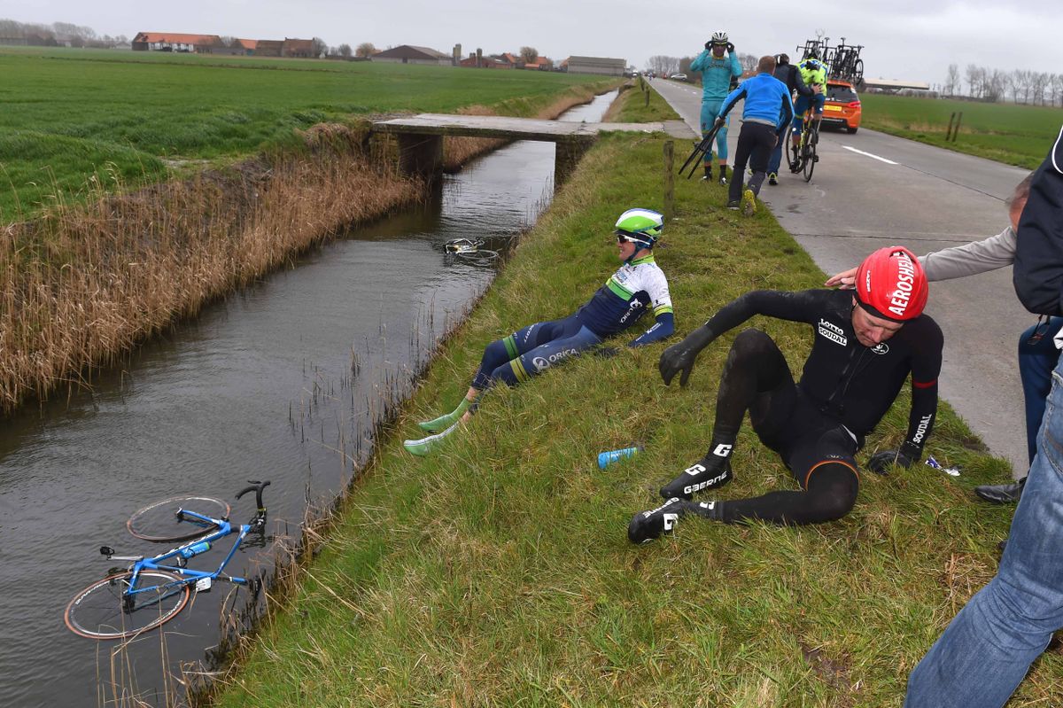 Luke Durbridge looks at his bike enjoying a swim
