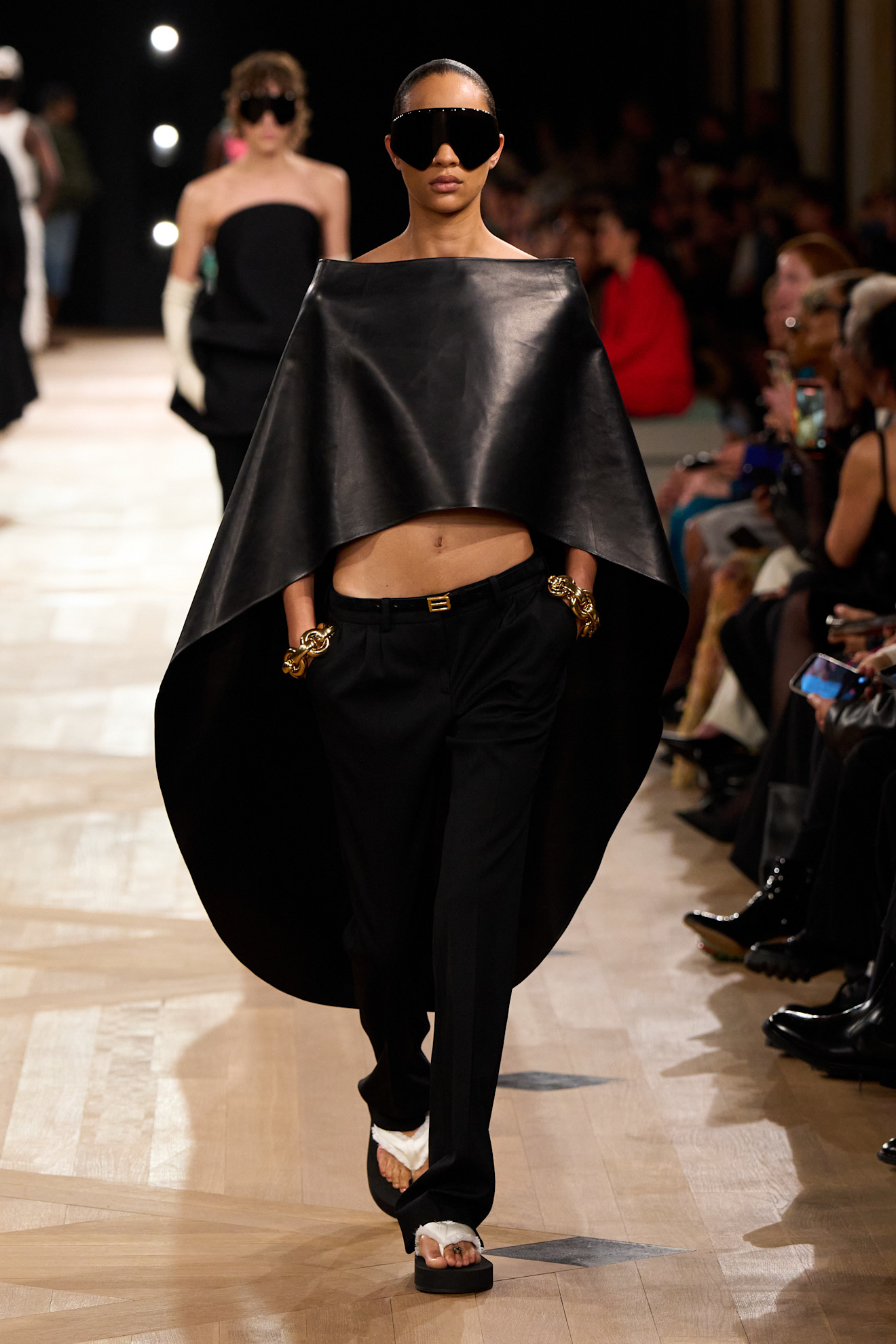 A model wore a poncho at the Balenciaga Spring 2026 fashion show