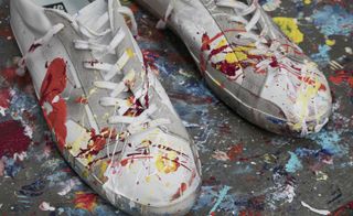 A pair of paint splashed trainers