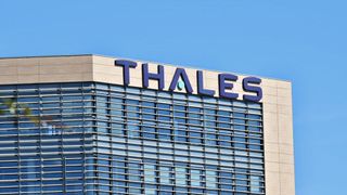 A close up shot of a building with the words Thales displayed at the top