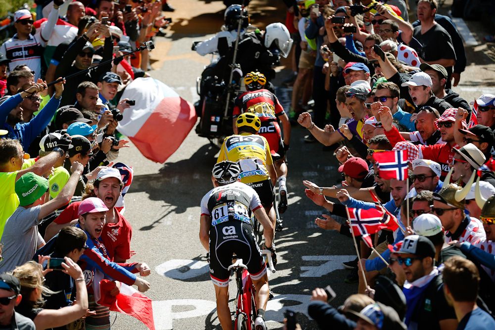 Richie Porte, Chris Froome and Bauke Mollema make their way through the crowds on Mont Ventoux