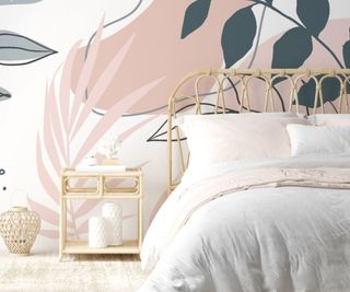 pink and blue botanical large mural wallpaper with bamboo framed headboard, bed with white bedding and bamboo bedside table