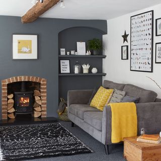 living room with grey wall and fireplace