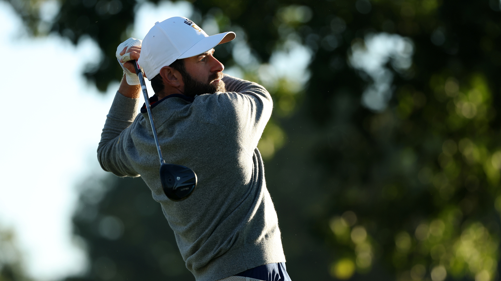 Cameron Young hits a fairway wood